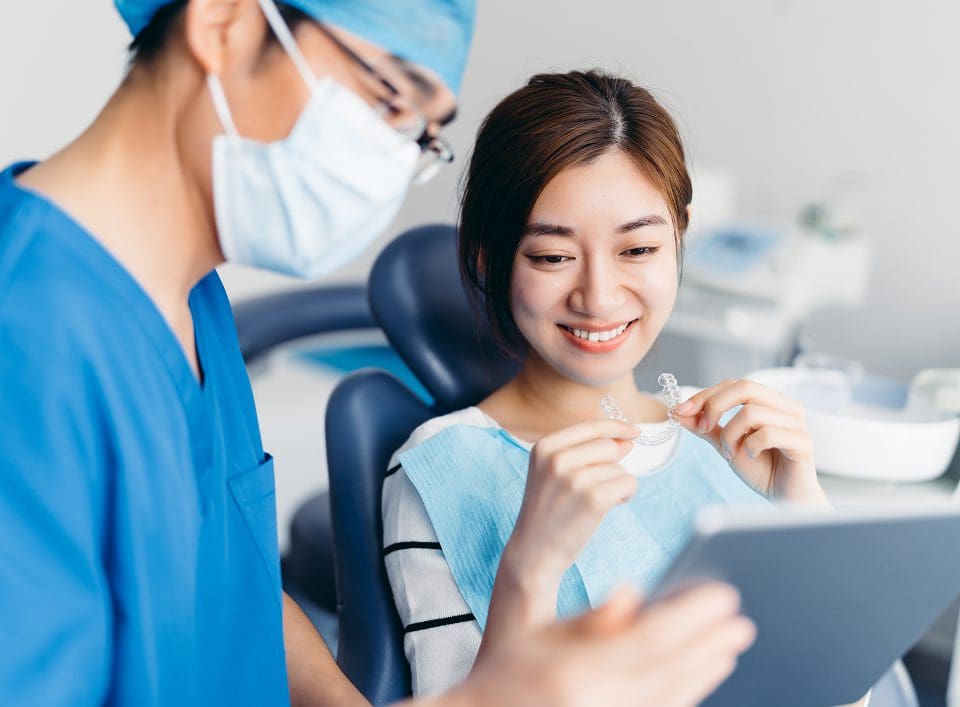 Dentist and patient discuss treatment options