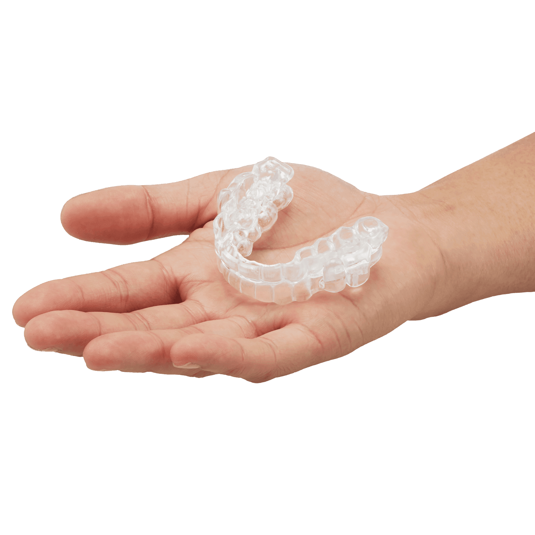 Hand holding a transparent dental aligner for teeth straightening.